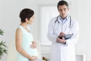 At what stage of pregnancy is the second prenatal screening performed, what does ultrasound show?